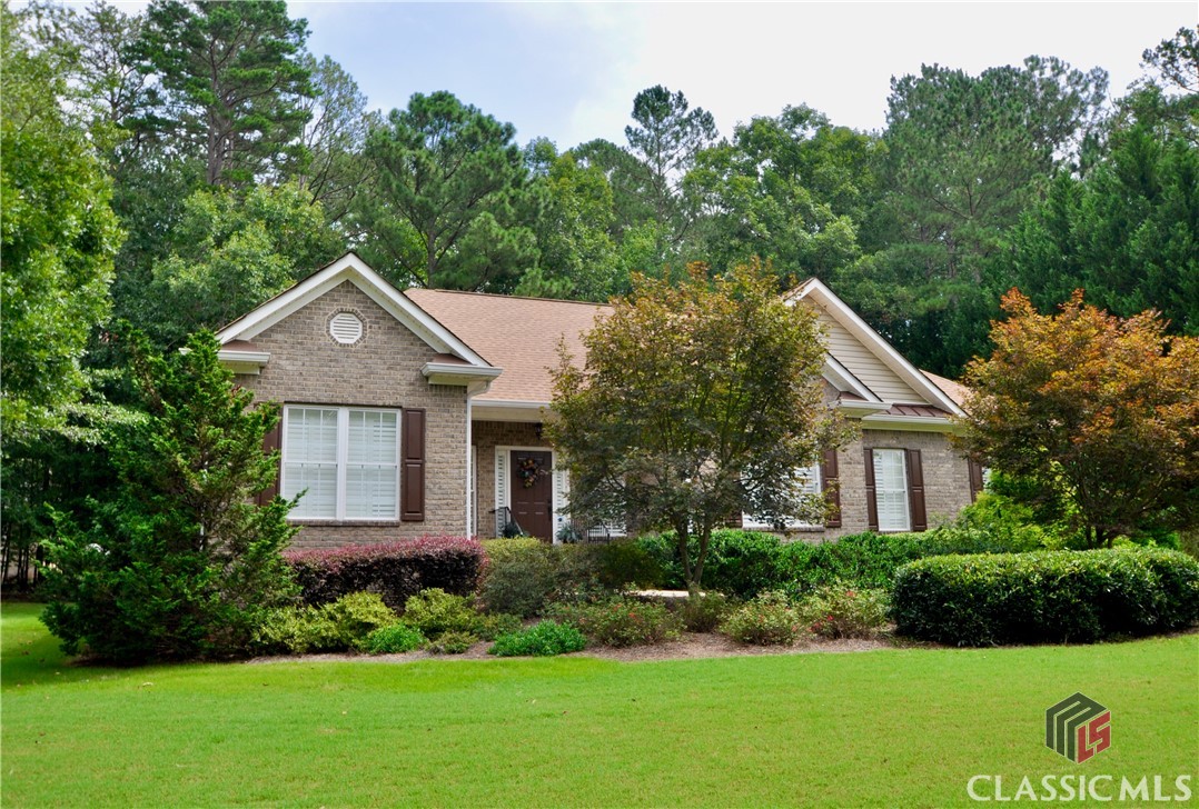 This incredible four-sided brick ranch home is nestled in the lovely Lane Creek Plantation subdivision where you will enjoy community convenience to golf, tennis, swimming, and more. This sprawling split bedroom  floor plan offers three sizable bedrooms and two full bathrooms in just over 2,000 heated square feet. The .69 acre lot features a large, private backyard where you can play, relax, or entertain. The interior hosts a modern and favorable layout and vast array of features including granite countertops and newer appliances, fireplace in the great room and a vaulted sunroom that was added by the current owner as well as the tiled patio for enjoying. Well maintained, the roof was replaced in 2019, the septic was serviced in 2018, and the home is covered by a termite bond. This spectacular property is zoned for North Oconee schools.