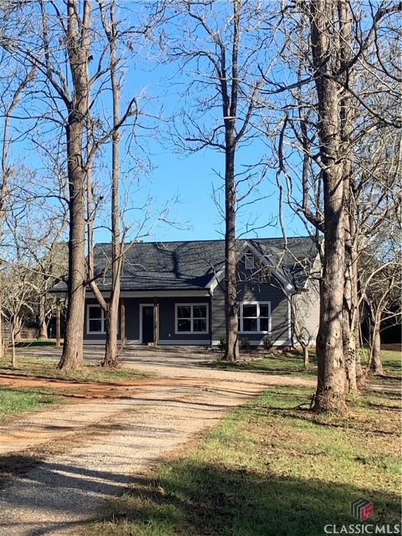 Sweet Oconee Cottage on over an acre of land minutes from downtown Watkinsville, Wire Park, and UGA.  Recently built in 2021, this 3 bedroom, 2 bath home is move-in ready. NO CARPET and professionally tiled throughout. The lot is flat with mature trees on the front and flat and open in the backyard.