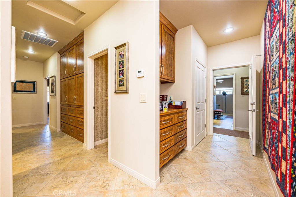 Center Hall with Expansive Built In Cabinetry
