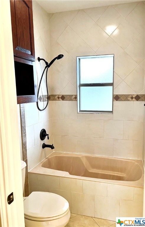 Guest bathroom tiled, tub/shower combo