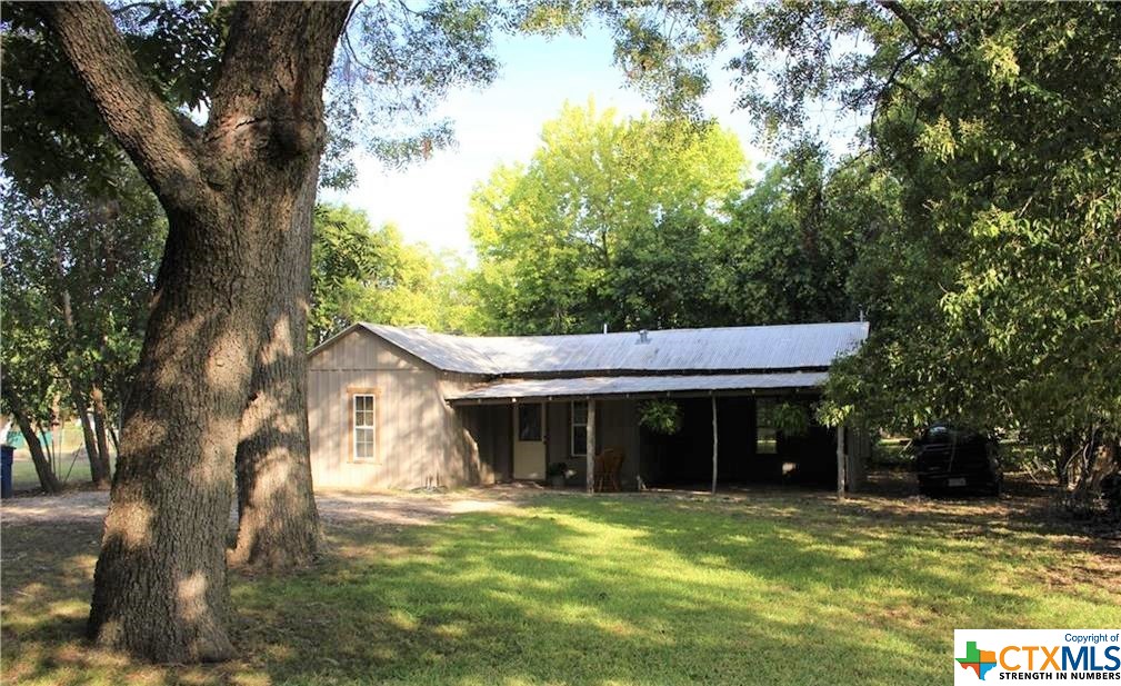 Back of house w Pecan trees