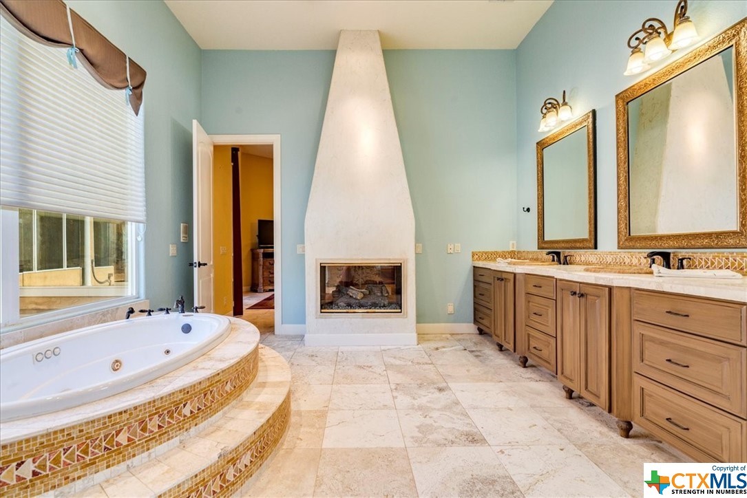 Soak in the is jacuzzi tub with your fireplace on
