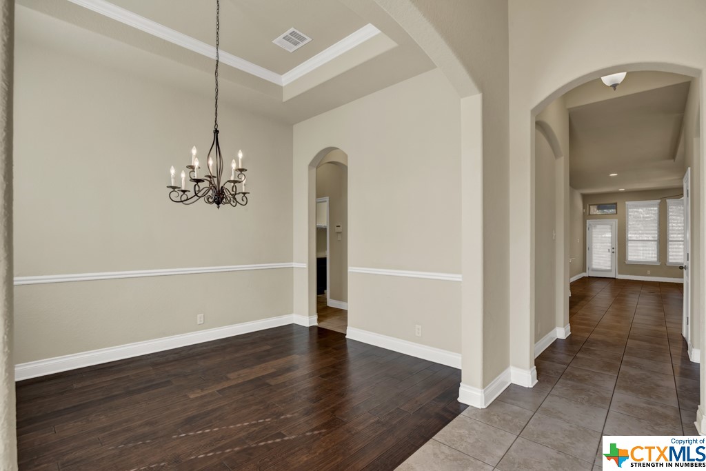 Formal Dining with entry to Kitchen/Pantry and Living area