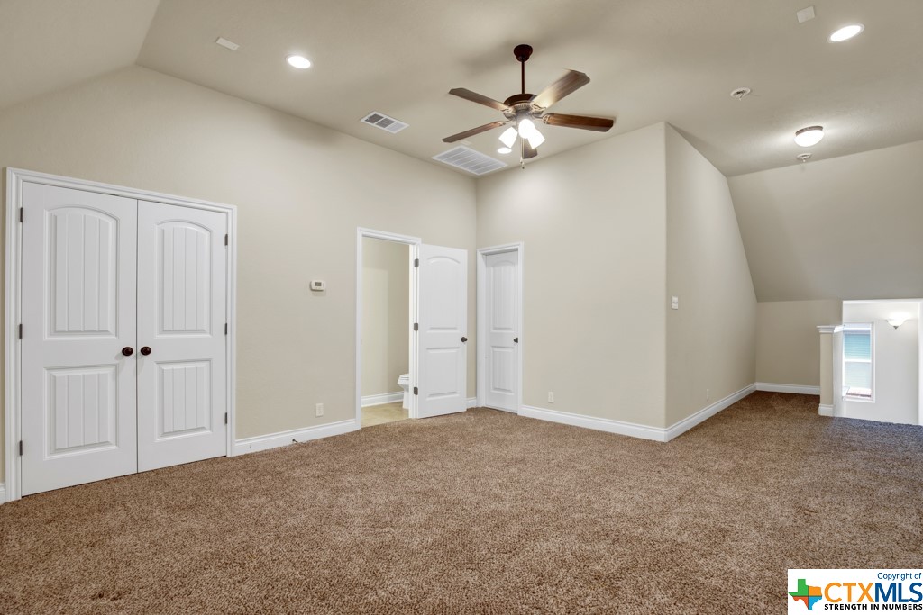 Game/Media Room with landing on upper level with walk in attic access