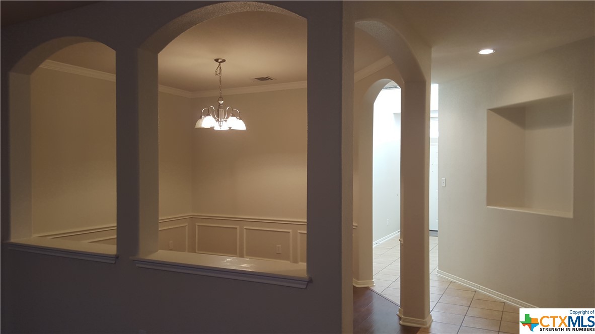 Lighted Art Niches in entry hallway to Formal Dining Rm