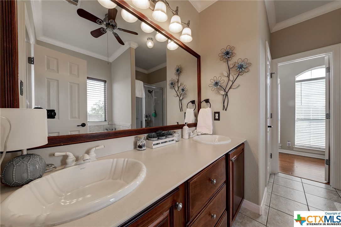 A dual vanity and cosmetic lighting are highlights in the primary bath!