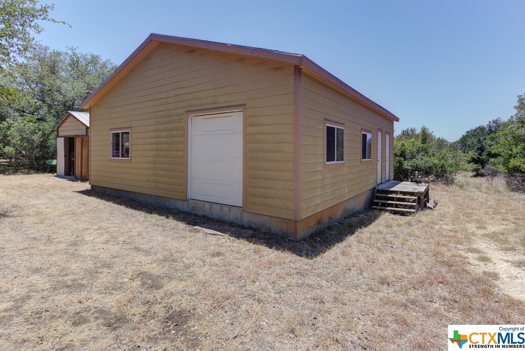 Exterior of workshop with extra storage building.