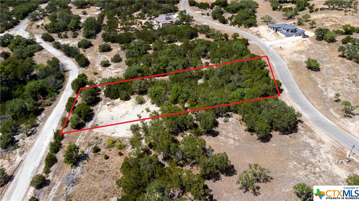 Private 1.28 Acres w/Hill Country View in gated Waterfront Community.