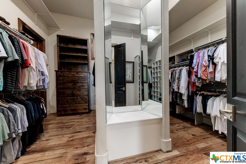 A shopper’s paradise. This closet has adequate spacing via shelving, built in cabinets and hanging rods for all your attire, shoes and accessory collections. With a multi-view full length mirror, you won’t have to question if all aspects of your look are spectacular.