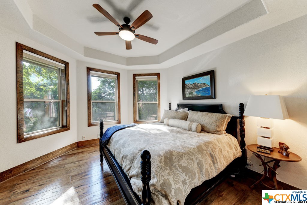 Adorned with natural light, this room exudes comfort and features a walk-in closet and full bath.