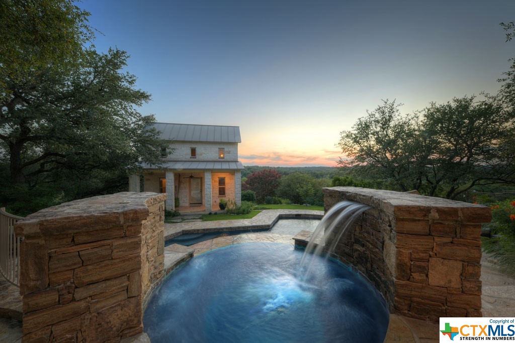 The elegance of the design with the waterfall flowing into the jacuzzi is one belonging to paradise alone, and the water then cascades into the pool below.