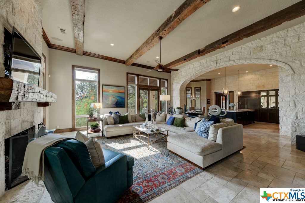 Under the natural light, it is easy to appreciate the magnificent living room – complete with a Sisterdale rock faced gas fireplace, built-in cabinets and shelving, as well the ceiling beams and mantel piece which have been reclaimed from a historic​​‌​​​​‌​​‌‌​‌‌​​​‌‌​‌​‌​‌​​​‌​​ church.
