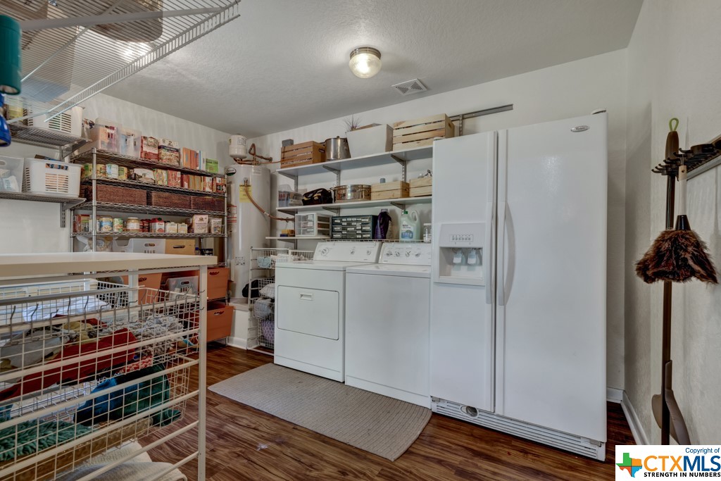 large pantry and laundry area with door to outside patio
