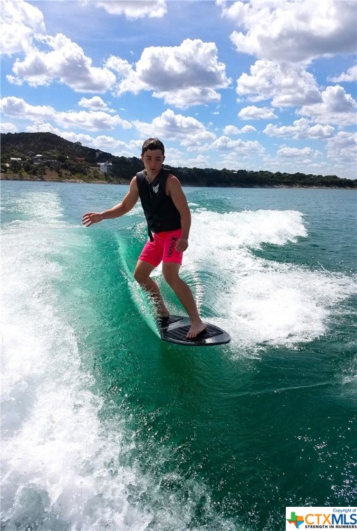So many water sports to enjoy and partake in. Here's a little wake surfing in the crystal blue waters of Canyon Lake.