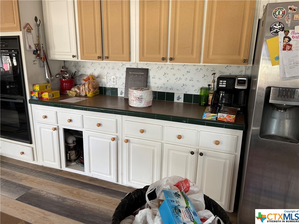 There is so much cabinet and pantry space!  Truly a great working area!  Double Oven, to boot!