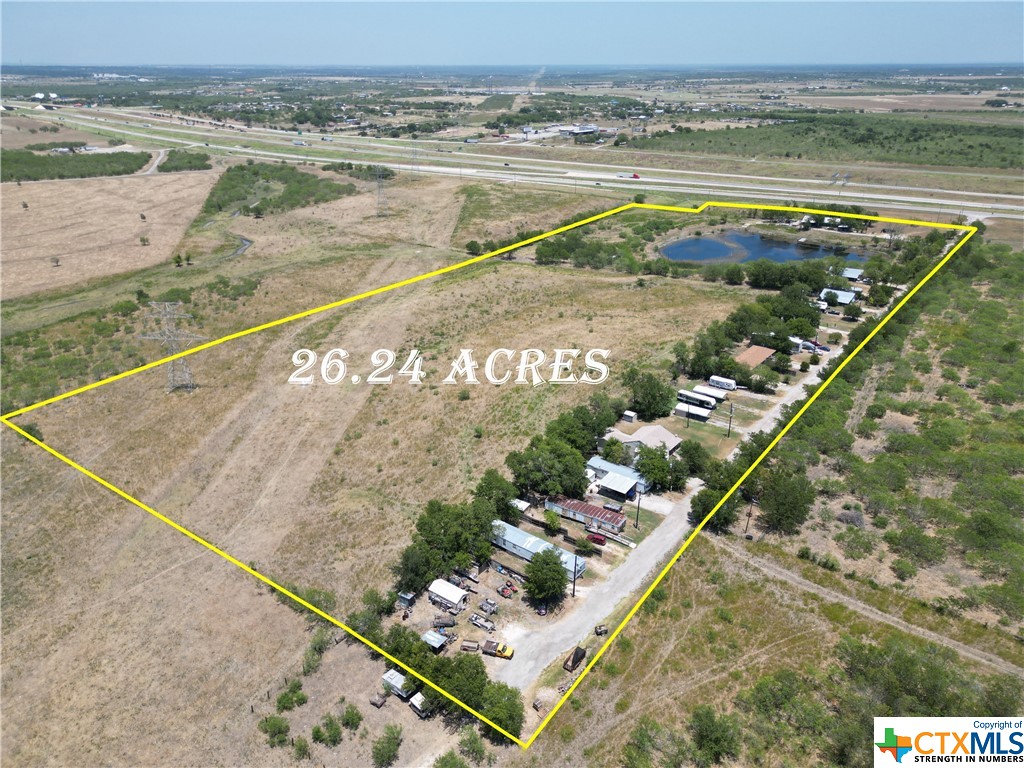 Incredible potential with this 26.24 Acre property located 10 miles north of Lockhart on S Hwy 183 / SH 130. Short drive to Austin / ABIA, Tesla, or San Marcos / Bastrop. Approximately 740' of highway frontage. There are 5 site-built homes, 2 manufactured homes, and 1 duplex included with the sale. Also, there are 3 RV sites rented out and 3 sites for mobile homes also rented out. Estimated gross monthly rental income when fully occupied is around $9,500 (one unit is vacant currently). There is a large (2-3 acre) stock pond near the front that provides a nice recreation spot for the property. Additional land available to be purchased to the north under a separate listing.