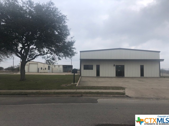 Site has 3 bldgs on 1.3528 acres.  Access the security fenced yard through double doors fr Rio Grande or W. Industrial Way.  The main bldg has a lobby & 4 offices, 2 of these offices in the business portion of the building & 2 in the shop area.  There are 3 storage areas and a large, decked storage areas and 2 restrooms.  The shop area of the main building is approx. 5,980 sq. ft with 2- pedestrian doors & 2- 14 x 14 overhead doors.  The roof clearance is approx. 16' peaking at 17'11".  3 phase electricity, 240 and 110.  Bldg 2 is a metal building on a slab, approx. 50 x 25, with 2- 12 x 12 overhead doors and 1 pedestrian door. Bldg 3 is a metal building on a slab, approx. 1800 sq, ft that includes the craneway.  This building has a 2-ton crane, not currently operational.  1 pedestrian door and 2-12' x 13' overhead doors.  There are 16+ parking spaces.  There are two central ac/heating units. 3 Yr Lease in place $4,000 per month beg 04/01/23, plus T & I increases over base year 2023