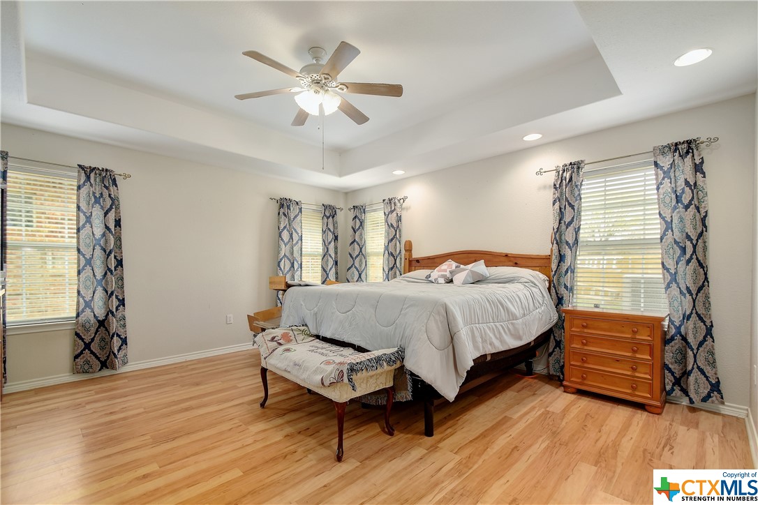 With the warm tones in your flooring, high ceilings and lots of natural light the primary bedroom is a true santcuary for peace and relaxation.