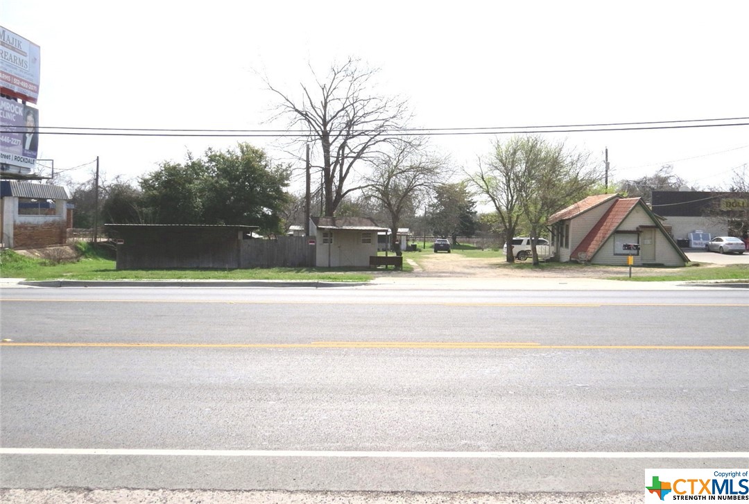 Hwy. 79 frontage. Within 35 minutes from Samsung facility, within an hour to Austin, Bryan College Station Temple and 45 minutes to Round Rock and 25 minutes to Taylor. Zoned commercial. Please contact the City of Rockdale for what is allowed for commercial use of property. City of Rockdale no longer allows mobile homes in city limets, existing mobile home is grandfathered in. Building area total includes A-frame building, small wooden building located at front of property and the mobile home - sq. ft. of areas are approximate.