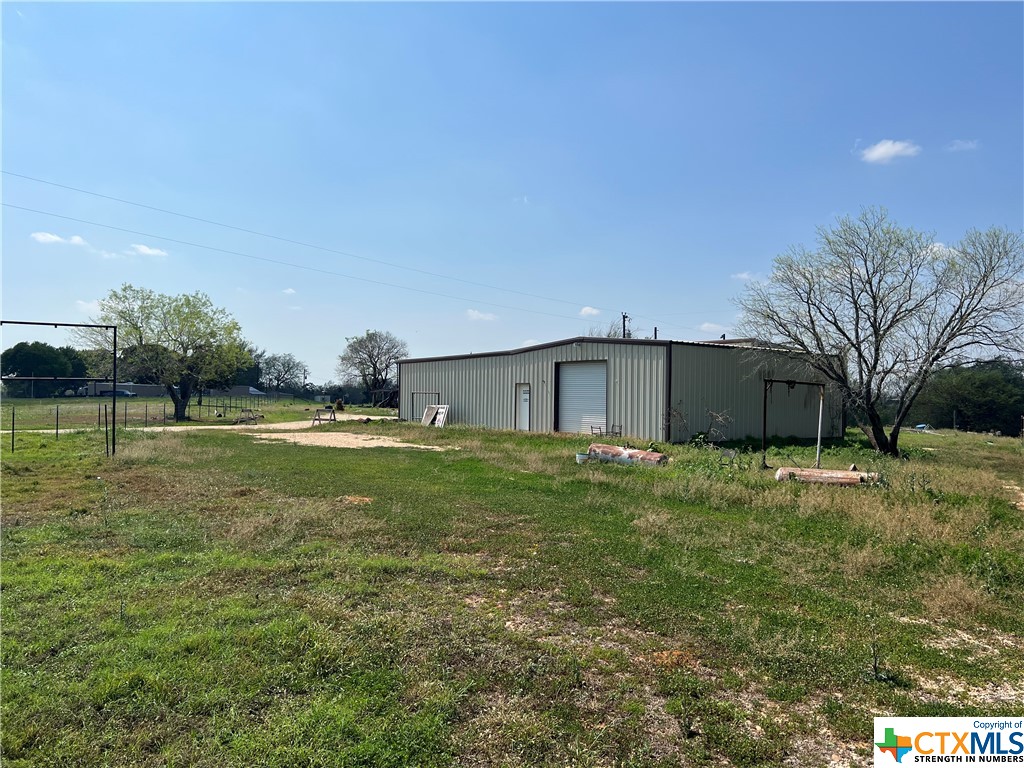 Great property that has access to a small creek and pond. Large metal shop with an RV carport as well as car parking. Shop currently has an office an bathroom. This property would be great for anyone looking to build, build out the metal buildings for a home, or even commercial purposes.