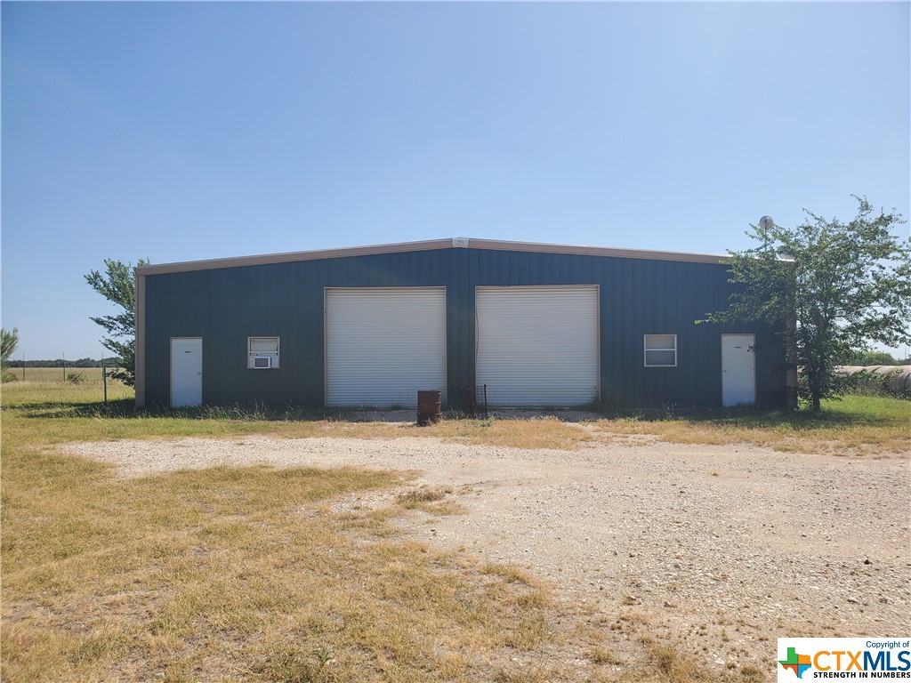 ndustrial warehouse with 4 individual offices, kitchen, full bathroom with shower and area prepped for additional bathroom.  Large roll up doors for easy access into main warehouse area.  Newer 3/2 single wide mobile home located on site.  Located conveniently off of Hwy 90 behind Randolph Auxiliary Airport.  Owner would consider owner finance with the right conditions.  Warehouse building is approximately 3,250 sq feet and mobile home is 1,216 sq feet per appraisal office.
