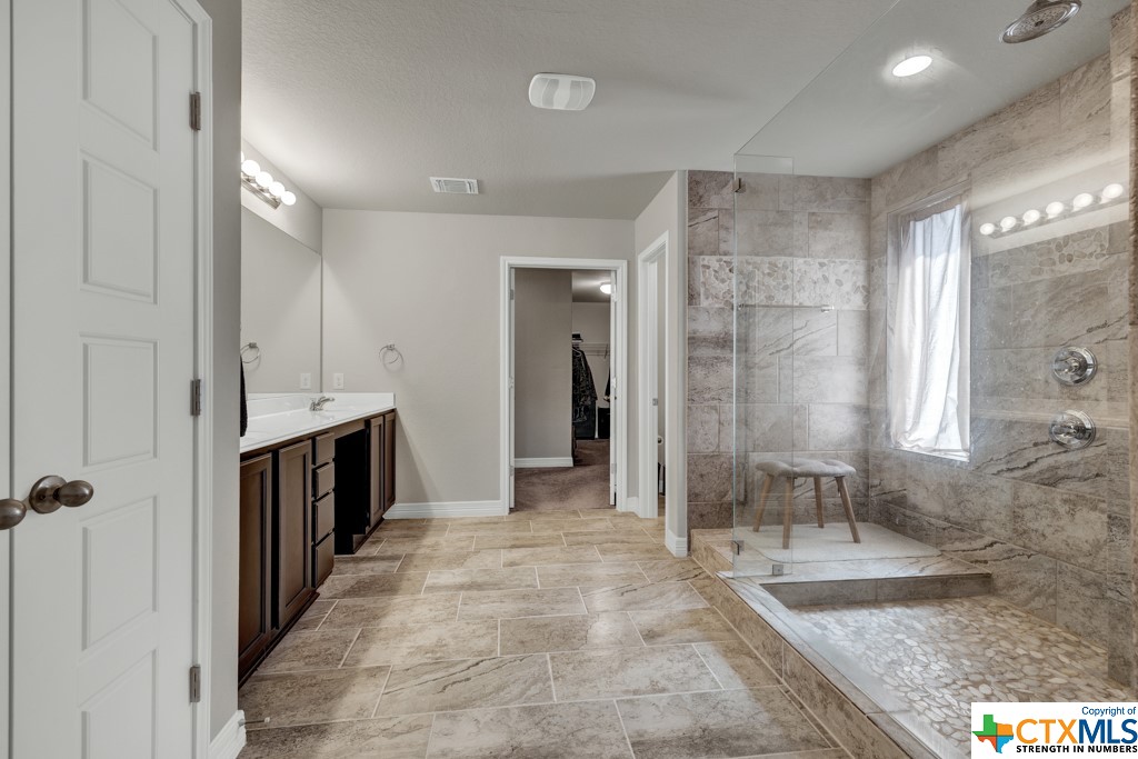 Master bathroom with large walk in shower and dual shower heads