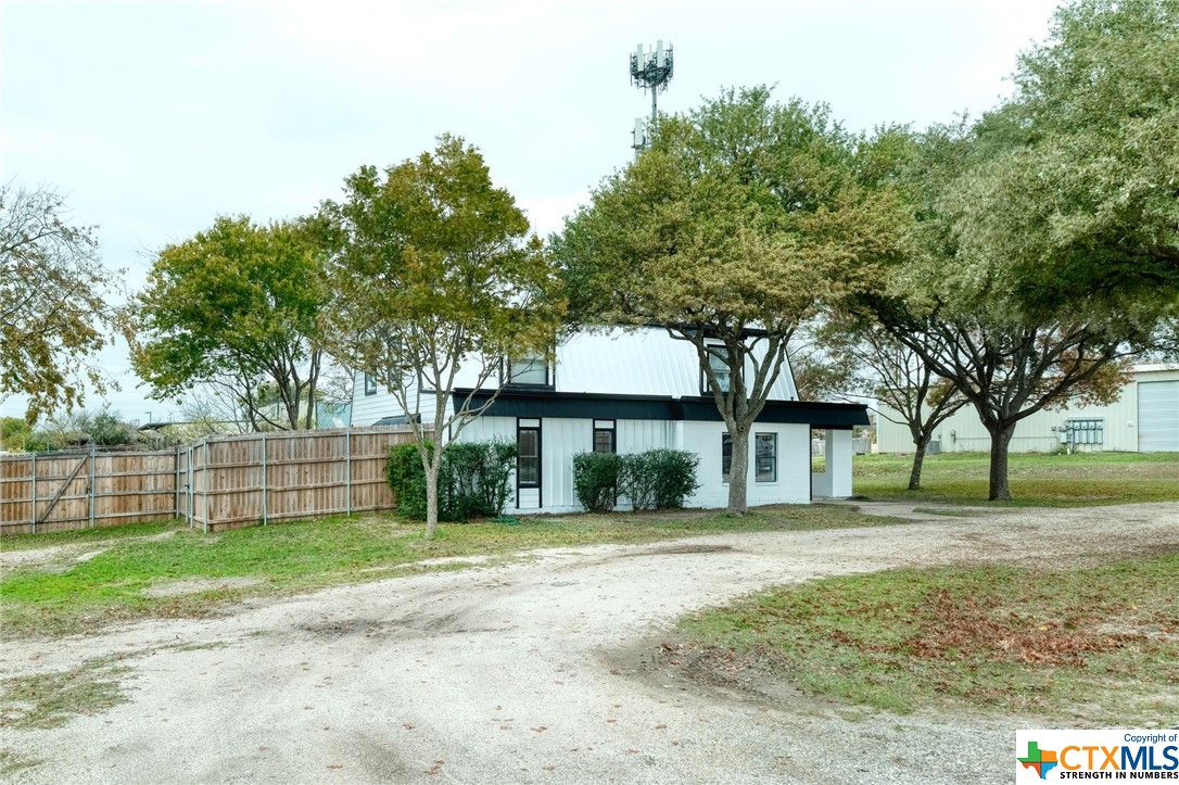 Endless possibilities for this almost 1 acre in Pflugerville ETJ (not in city limits). Fast growing commercial area with convenient, easy access to SH-130, SH 45 and Gattis School Road. No zoning restrictions. Main building features unique steel beam construction with Standing Seam Metal Roof; Suitable for office with large main area, 4 bedrooms and 3.5 baths with additional interior storage/office space. Work/live on nearly one acre with few restrictions. Main building has over 2500 sq. ft. Exterior has deck, fenced areas & shed with additional exterior covered storage. Additional parking on side yards if needed. Exterior and interior remodel/repairs. Very easy access to Austin area Samsung locations and other major tech. companies! Call agent for access code. Don't Miss Out on this Hidden Gem!!