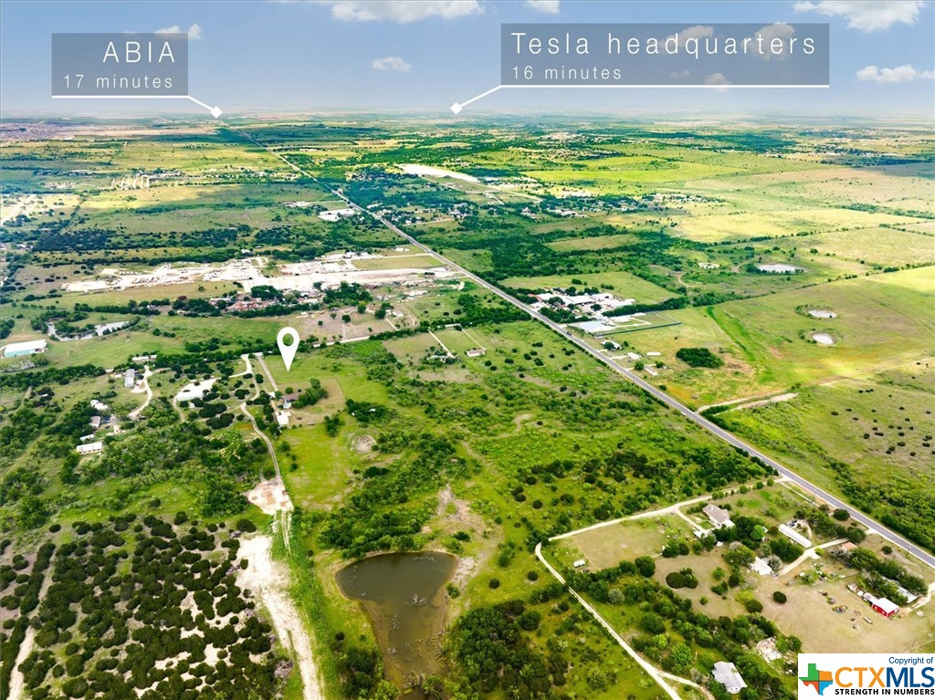 Fantastic investor or primary residence opportunity minutes to Tesla, downtown Austin, and I45 Toll.  Nearly 20 acres with 558'+/- of road frontage and dual entrances on two sides of the property.  Generally level terrain with some flood plain that keeps tanks level.  Unrestricted and can be rezoned commercial or subdivided.  The 3000+sq ft home has 5 bedrooms 3.5 bathroom, and an open floorplan.  The fully fenced backyard has a gorgeous in ground swimming pool.  You'll love the privacy this property offers.  The 30'x30' workshop is just beyond the home and is on slab.  Low tax rate and currently AG exempt.  Located in the Opportunity Zone.  Contact listing agent for details the possibility of a public sewer line at street.