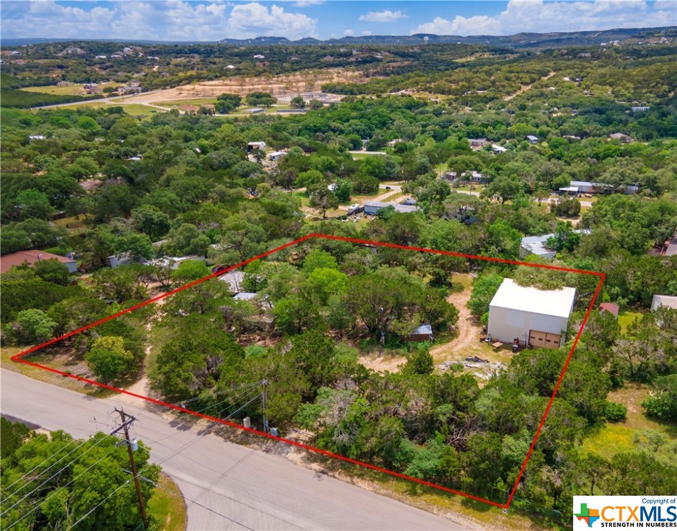 Welcome to your Hill Country Oasis! This 1 acre lot offers the perfect mix of peace and convenience, providing the best of both worlds right at your doorstep. Located just a stone's throw away from Canyon Lake, you can enjoy all the outdoor activities this scenic lake has to offer, including fishing, swimming, boating and more! This lot also features an RV hook up with septic tank already in place - so you can bring your RV along for easy weekend getaways or extended stays. There is even a covered carport included on the property for extra parking or storage needs. Surround yourself with nature as this idyllic lot is dotted with lots of mature trees that provide plenty of shade throughout the day. Manufactured homes are allowed here and horses are welcome too - making it ideal!