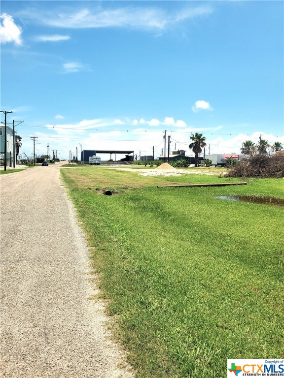 Interior lot (51'x102') w/paved access & limited views of the City Harbor area. Elec. is available. Please get estimate of install of water/sewer services from City of Seadrift. Location is on the "Old RRRow" location which brought trains to Seadrift in the early 1900's...no restrictions. (setbacks).  Location faces east, and is approx. 1000' from the boat ramp/city harbor, minutes to the lighted fishing pier & Bayfront Park. Area is very popular sports fishing, birding, duck-hunting area. City Harbor is a "working" harbor with shrimp boats, crabbing, oystering in season...our small community has NO traffic lights, a paid police service, volunteer fire/EMS services...several popular restaurants...Seller does have a current survey & metes & bounds description of the property.