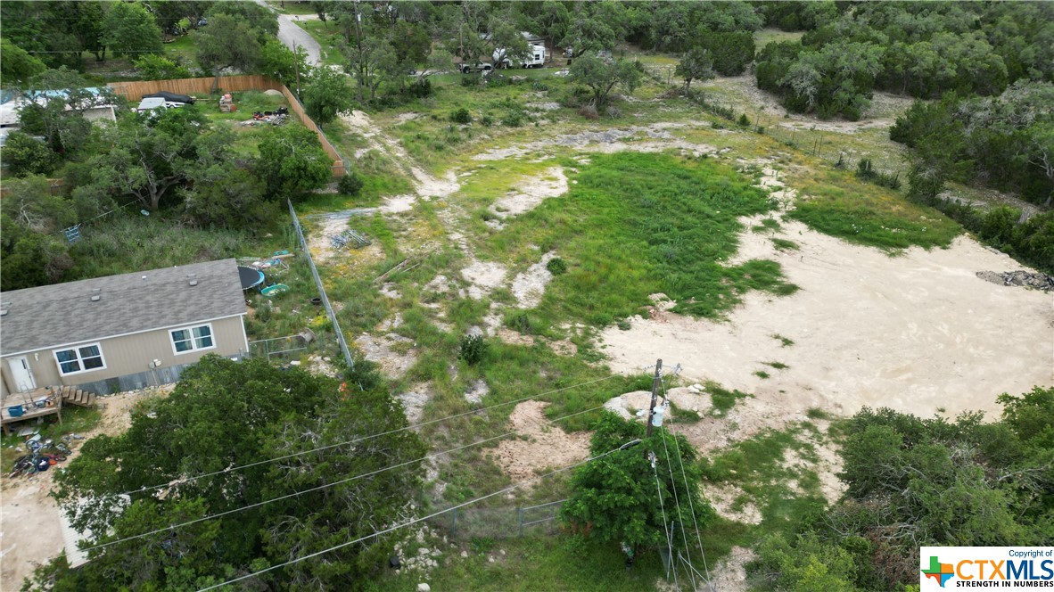 Oversized lot to build your dream home.  Great hill country and lake views from a 2nd floor that is at an extremely affordable price. This lot is cleared and ready to be built on.  Survey available. Neighborhood has relaxed restrictions and STR's allowed.  The neighborhood is full of amenities with a community swimming pool, clubhouse and playground. Close to Cranes Mills Marina, Comal park and shopping.  Also see other lots for sale 1192 Deer Run Pass and 1214 Deer Run Pass.