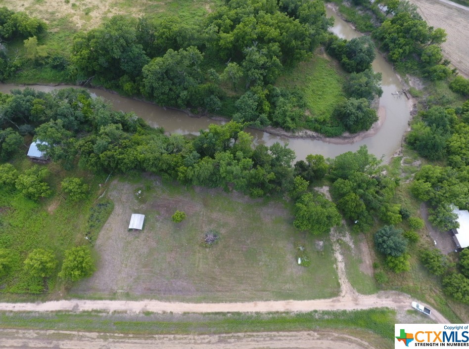 Rare river front property!  Nice 1.82 acre lot on the San Gabriel River.  Great mix of open area and mature trees along the river bank. Water well, septic system and two electric meters in place.  This rural property is ready to build your dream home or relaxing weekend getaway.