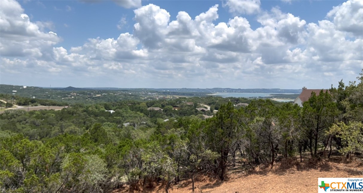 Lot 78 is a 0.51 acre homesite located in The Point at Rancho Del Lago that offers rear hill country and Canyon Lake views , numerous scattered oaks, and several level building sites to choose from. Build up top to enjoy the views of Canyon Lake and the Texas Hill Country or build towards the bottom for more privacy. This homesite is only 2.1 miles to Brookshire Brothers and 3.6 miles to the marina. Only a 1500 square foot home is required and there is no HOA. You can also purchase the adjoining lot and have over 1 acre for $179,900! There are numerous Short term rentals in the neighborhood. Some of the lake view pictures are from the neighbors property, adjoining streets and lot across the street to show the potential lake views these lots can offer