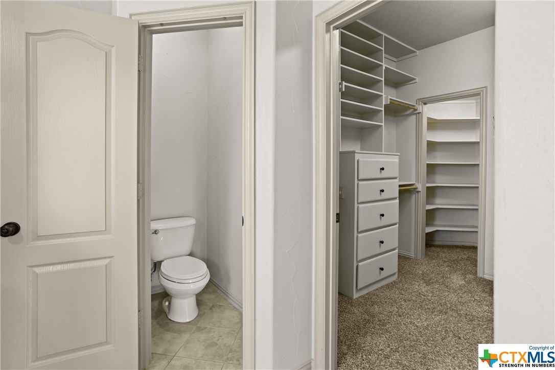 Master Bath + Master Closet with Hideaway Secondary Closet under Grand Staircase