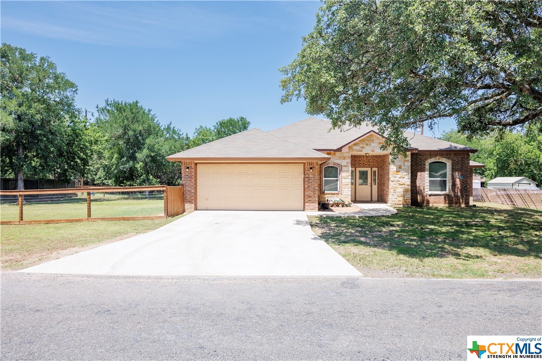 33 Cottonwood Loop is a perfect place to call HOME! This 3bed 2bath is in the heart of Morgan's Point with easy access to parks, and the water (just a few minuet drive). This house was built in 2018, and has mature trees, fenced in back yard, covered back porch with an added space which has been filled with crush granite perfect for entertainment. The living space within has an open floor plan. The kitchen has an over sized island/breakfast bar. The master bedroom is spacious and leads into the mater bathroom which has a soaking tub and separate shower. This house is sure to impress.