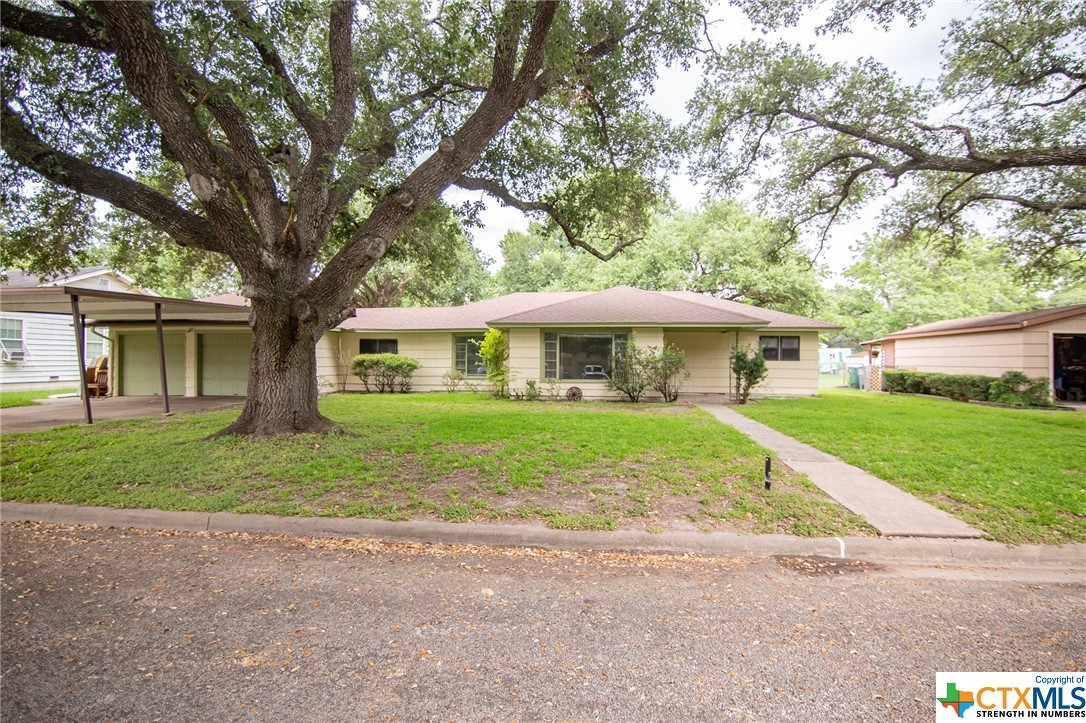 Located two blocks from the College you will find this amazing oak tree-shaded 3Bd 2Ba Home. This home features all vinyl flooring throughout the house, numerous built-ins, and a large accessible shower in the primary bedroom. This home also offers a covered patio as well as Two 2 car carports plus a 1.5 garage. The workshop is located in the backyard and is oversized for a craft room or Studio space. This is a must-see property.