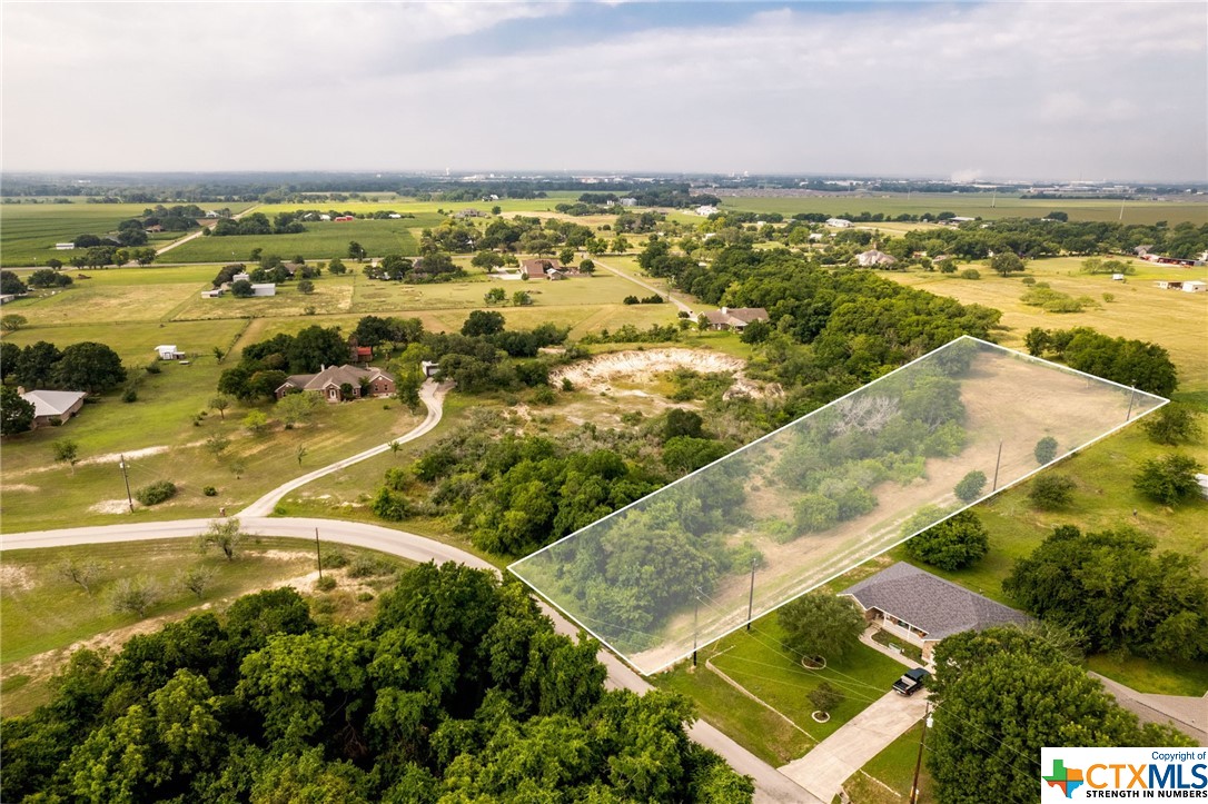 Beautiful, private, 1.9 acre wooded Oak Springs lot in Navarro ISD. Level and ready to build! Interesting topography with potential to make this a park like setting. No floodplain on the property. Adjacent to a historic quarry. Surrounded by acreage lots with custom homes. Utilities provided by Springs Hill Water, GVEC electricity and Fiber Internet. Deed Restrictions and Survey available. Restrictions require 1,400+ sq ft home and concrete or paved driveway. Cows, horses, sheep and goats allowed @ 4 head plus 4 offspring.  No thru traffic on Oak Springs Drive. No active HOA. No City Taxes. Centrally located in Texas to Seguin, San Marcos, and New Braunfels. Easy access to FM 20 and SH 130 to Austin and San Antonio.