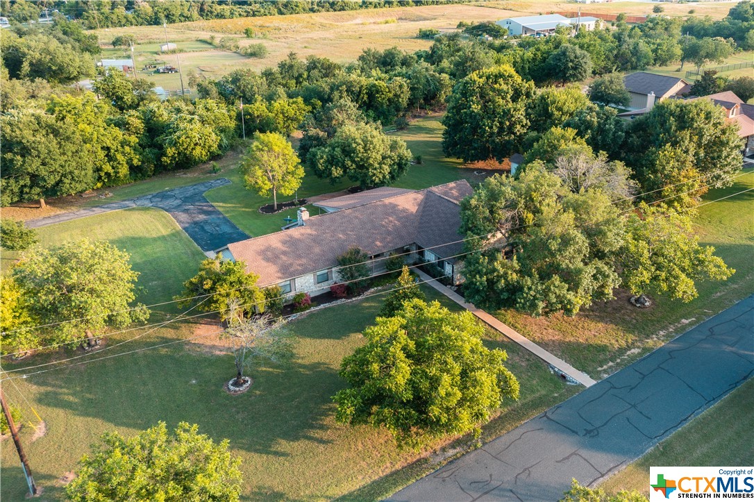 Great custom built home on almost 1 acre corner lot in a quite neighborhood.  This 4 bedroom 2 bath home is the perfect place for country living with large pecan and oak tree's.  It's outside the city limits but only 3.5 miles to downtown Georgetown.   Plenty of room in this large open family room for entertaining or just relaxing.  The large Kitchen features granite counter tops, open to the dinning and family room.   All bedrooms are generously sized and ready for all your things.  The large covered back porch is great for sitting and watching deer and other wild life.