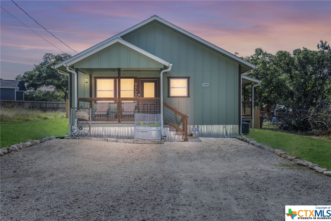 **OPEN HOUSE Saturday - Sunday, June 3 - 4 from 1pm-3pm both days***  
Enjoy peaceful living in the TX hill country in this charming farmhouse-style home, nestled in the neighborhood of Cypress Cove, with many amenities! Just minutes from a boat ramp, you’ll enjoy Canyon Lake and the Guadalupe River, a fishing pond, campgrounds, nature trails, tennis & pickleball courts, swimming pool, clubhouse, and more! 
This charming 2 bedroom, 2 bath home has a stunning tongue & groove cedar vaulted ceiling, solid pine wood doors, cedar barn doors, wood-look laminate floors, and cedar wainscotting on the island and living room walls.
You’ll be enamored with the high-end details, such as custom soft-close shaker-style cabinets, stunning quartz counters, white porcelain farmhouse sink, ambient under cabinet lighting, stainless steel appliances, windmill-type ceiling fans, metal roof, 3 covered porches, floor plugs in Living Room, windows that tilt in for easy cleaning. If you desire gas cooking instead of electric, there’s gas hook-up in the kitchen. Well-insulated home with CAT5 cable & wifi outlets. Partially fenced yard for your pets. Wide hallways, doorways, and a no-threshold, easy-entry shower.
Quick access to 281, shopping and restaurants nearby. Don’t miss out on this amazing opportunity to own piece of the gorgeous TX hill country and all it has to offer!