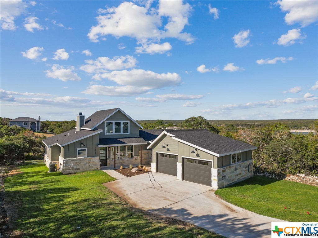 This unique custom home by boutique builder Lion House Construction is now available! This home is located in the gated Belton lake community of Tanglewood just 20 minutes from H-E-B Plus!, Scott & White, restaurants, and shopping. Home is constructed with energy-efficient appliances, quartz countertops, and a stone fireplace. There is a large deck accessible from the owner's suite and the living room complete with cable railing to take in the surrounding nature views and sunsets.  This neighborhood features a playground, clubhouse, pool, and walking trail to the lake. Construction will be complete in mid-June!