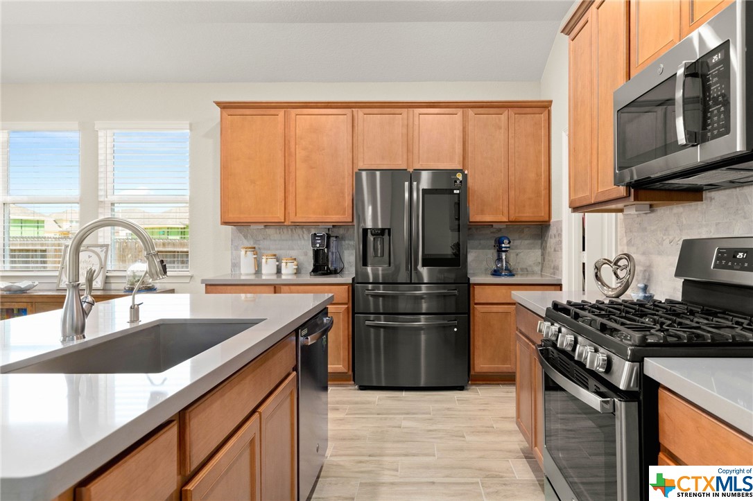 The smart refrigerator conveys with the property!  It has many capabilities including taking inventory of your groceries and connecting to the Ring security system.  Visitors at the front door or the back of the home can be seen on the face of the fridge when they come to visit.