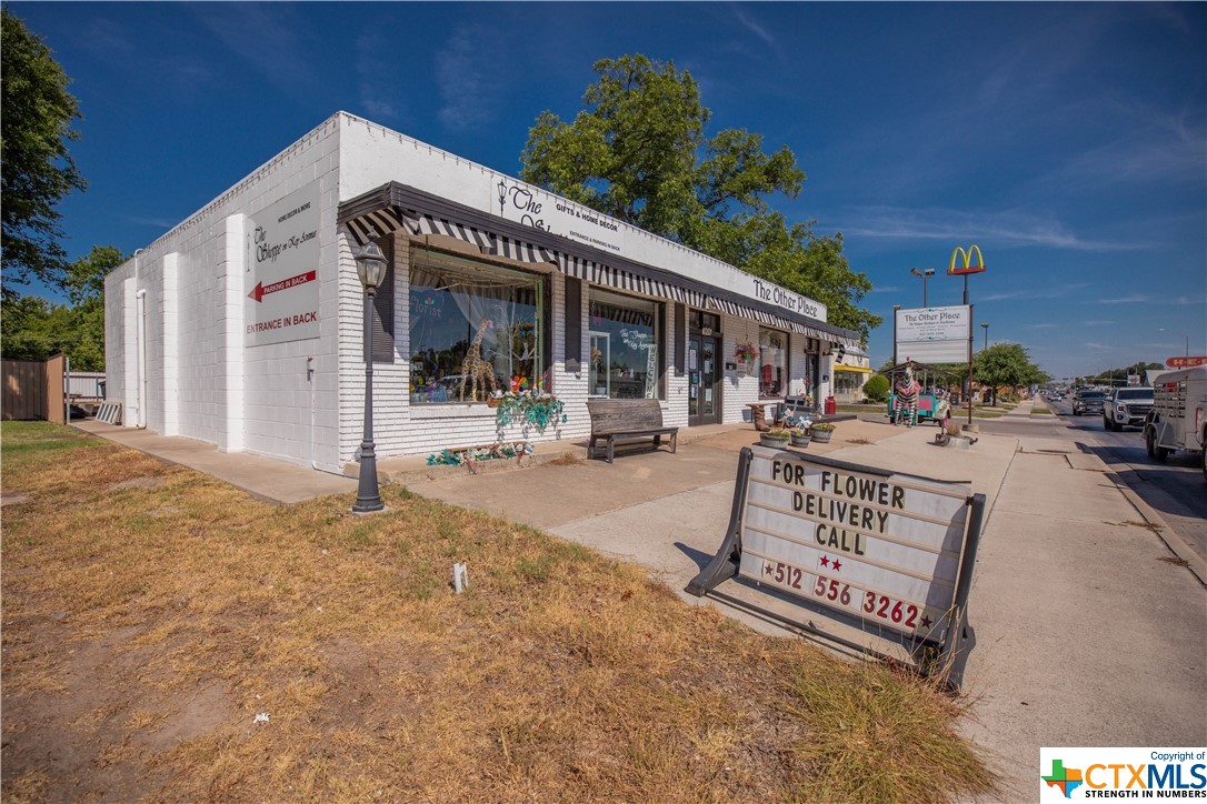 Talk about a great location!!! Prime retail location with high traffic in the main thoroughfare of Lampasas (Key Ave=Hwy 183)! This retail property sits right between McDonalds and Taco Bell and has ample parking. It is currently leased to two thriving shops: a floral shop and a clothing & gift boutique. Call today for more information and to schedule a showing!