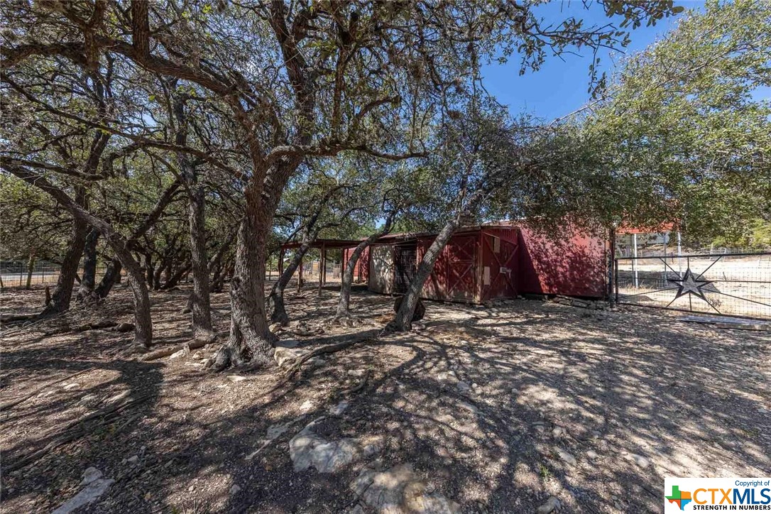 Three lots are being sold together.  There is a hay barn, an RV carport, and a small corral.  Build a house on one or on all three.  Driveway and front gate already in place.  Some nice oak shade trees to the front too.  Ask your agent about additional lots available and Bring your builder. NOTE: Comal Appraisal District shows all 13 lots in the account ID.  This listing is only for 3 of those lots.