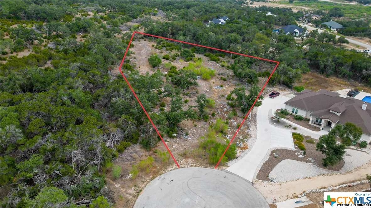 Here is the perfect spot to build your forever home! Nestled in the back of the neighborhood, this quiet, flat, almost 2 acre lot is on a cul de sac and backs up to a private ranch shielding you from back neighbors. Vintage Oaks is known for having some of the best amenities in the hill country area; you'll find four pools, a lazy river, children's playgrounds, five miles of maintained trails, a fitness center, ball fields and sport courts. There is also a clubhouse and a busy calendar of year-round activities and special events for all ages. Vintage Oaks is centrally located to make access to Austin, San Antonio or Fredricksburg a breeze.Come join this fantastic neighborhood and start creating never ending memories with your new neighbors!