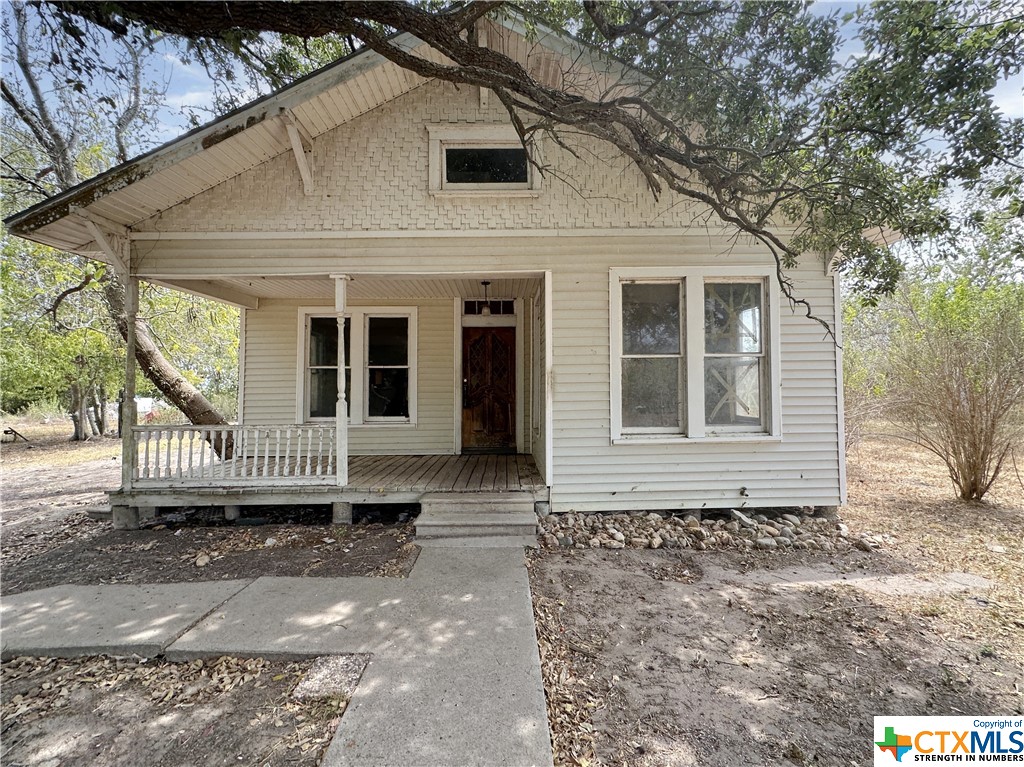 Cozy frame home with covered front porch, 3 bedrooms and 2 baths. The living area leads directly to the dining area and dining area leads to the kitchen with breakfast bar.  Needs some TLC.  Sold strictly as is.  Buyer to verify all property information.