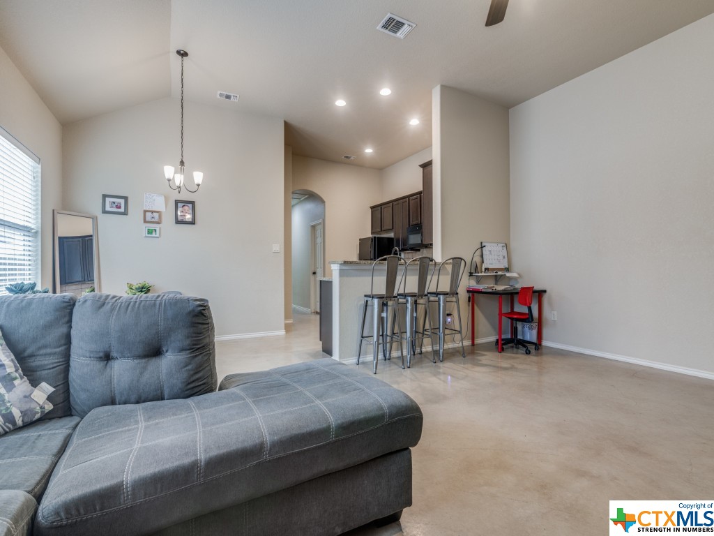 The spacious living room seamlessly blends into the kitchen and dining area, and a breakfast bar creates a welcoming​​‌​​​​‌​​‌‌​‌‌​​​‌‌​‌​‌​‌​​​‌​​ divide