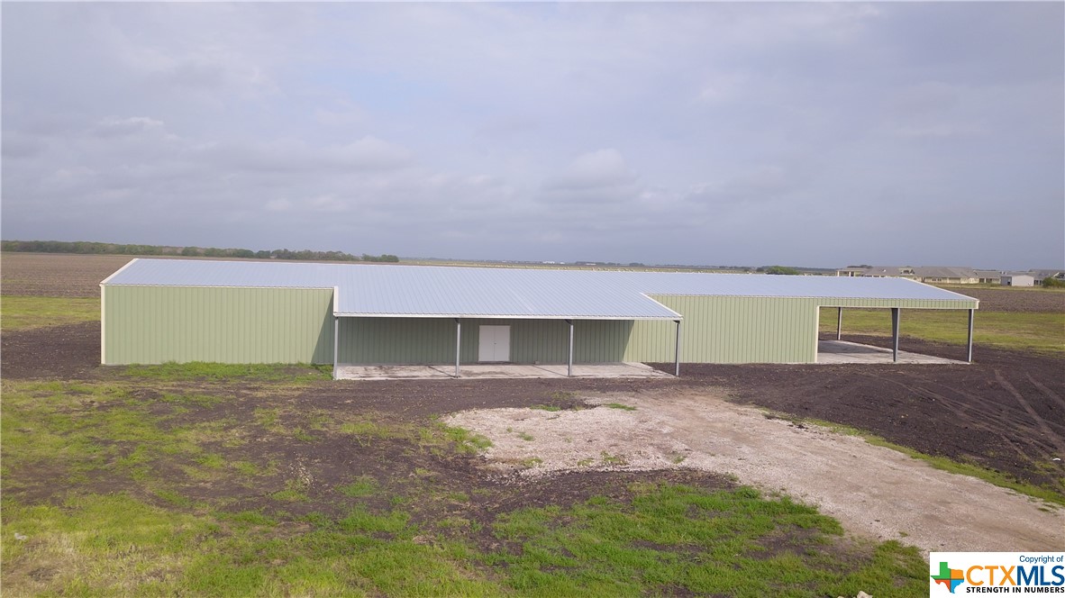 Commerical Building on 5 acres in great location. Metal building is 50x140 (insulated) with a 50x40 overhang and a 20x60 front cover. Building will need to be finished out; buyer will be responsible for utilities.