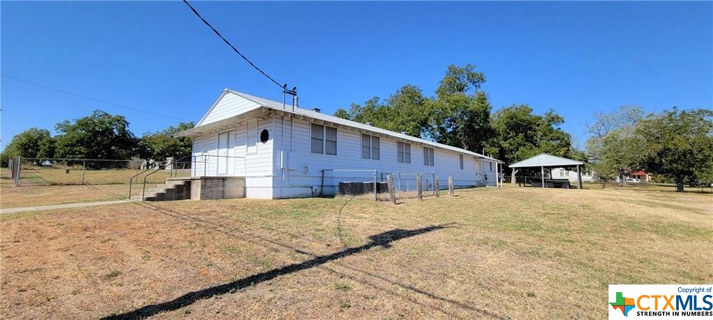 This commercial property could be the investment opportunity you were looking for! It has a multi-purpose building with 3,361 sq. ft. of space which includes 2 large storage areas, a spacious kitchen with a serving bar and restrooms. This property includes a utility building and a 400 sq. ft. shed to provide additional storage capacity. There is also a large carport area with an outdoor grill, perfect for large gatherings or parties. All of this is situated on a large 150' x 150' lot with plenty of room for parking. This property is currently being utilized as a meeting facility and is being rented for private parties. However, this multi-purpose property can be versatile and has many other options.