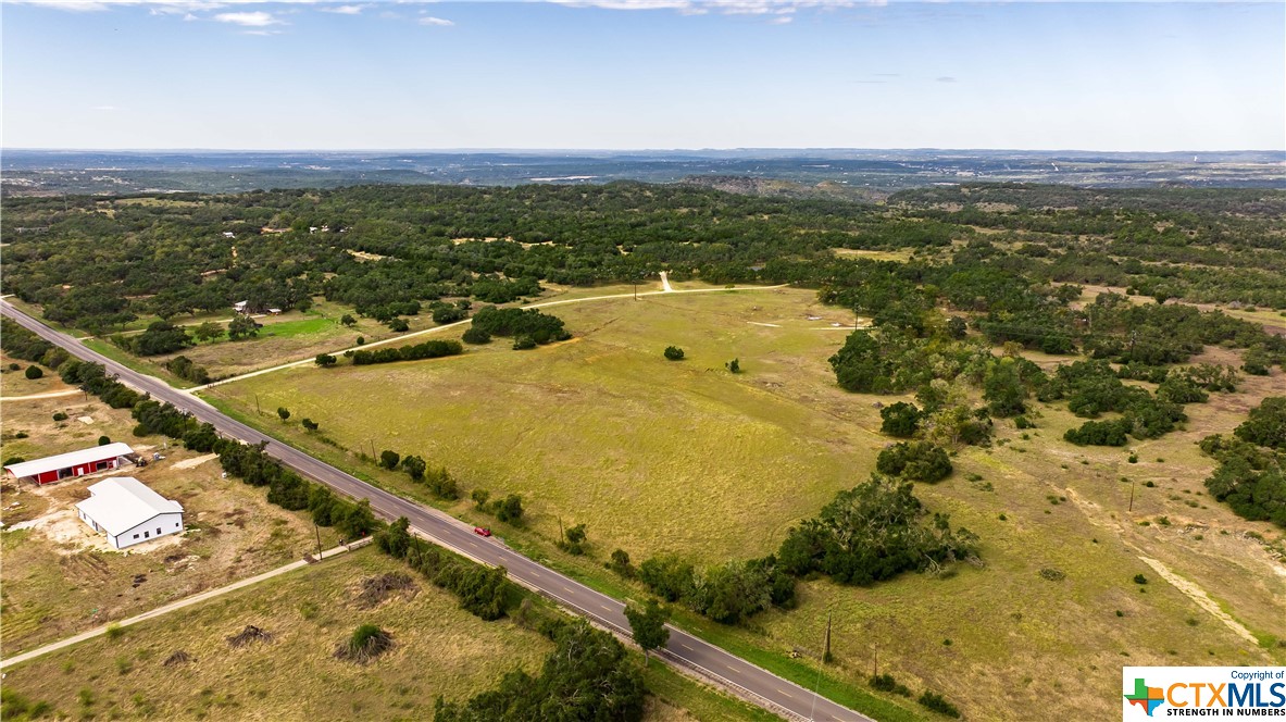 Unlock the development potential of this 14.5 acres on a high traffic corridor between Wimberley and San Marcos. Over 700 feet of highway frontage on FM 32!! This property has potential for RV/boat storage, retail strip center, wedding venue, sub-platting, residential development, and more. With the scarcity of flat lots boasting this level of road frontage, this property is truly a coveted investment opportunity for those desiring to be in a thriving region. Another big bonus is that it already has an agriculture exemption in place making it a great buy and hold investment too. Beyond its commercial potential, this rare find is also embraced by the natural beauty of the Texas Hill Country and has no flood plain! Act now to secure your exclusive viewing.