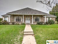 You won't find this unique 5+ acres in this area of Temple w/ a 2842 ft custom built home & detached garage! This property has spacious rooms & is loaded w/ upgrades including plantation shutters throughout & 2 separate master suites. Would make great offices for a business. Throughout the 5+ acres are beautiful Pecan trees nurtured by owners for many years, a detached single car garage (14 x 24) w/ lots of storage, a garden area (45x34) surrounded by chain link fence, a long driveway to a side entry garage & a circular driveway. All personal property inside the home, garage & detached garage, as well as exterior personal property does NOT convey. Sellers are working on removing them. Just under 370 ft of frontage, property is located in the heart of commercial businesses & across from Cross Roads Park & next to Vista Church. Only steps away one has access to walking/biking/hiking trails, parks, disc golf, batting cages, tennis courts & sport fields. Belton ISD. Hilliard Rd is conveniently located between West Adams-2 mins away for shopping, restaurants, entertainment & much more, and Hwy 36 with easy access to Draughon- Miller Regional Airport, I-35 & downtown Temple. Commercial opportunities are endless! West Temple has, and IS growing exponentially! Choose your passion, get it zoned accordingly with the City of Temple and begin building and living your dream!